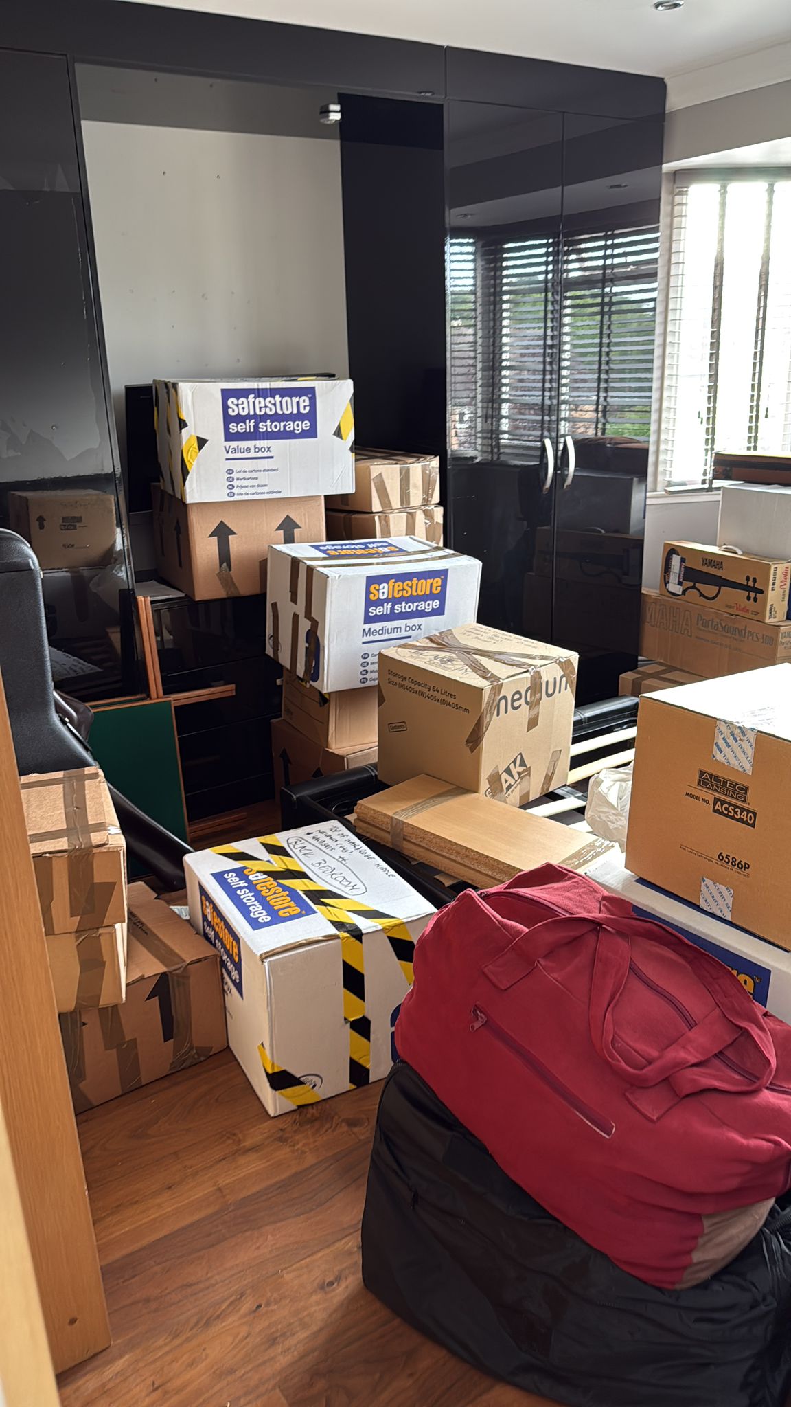 Empty room after clearance with boxes ready